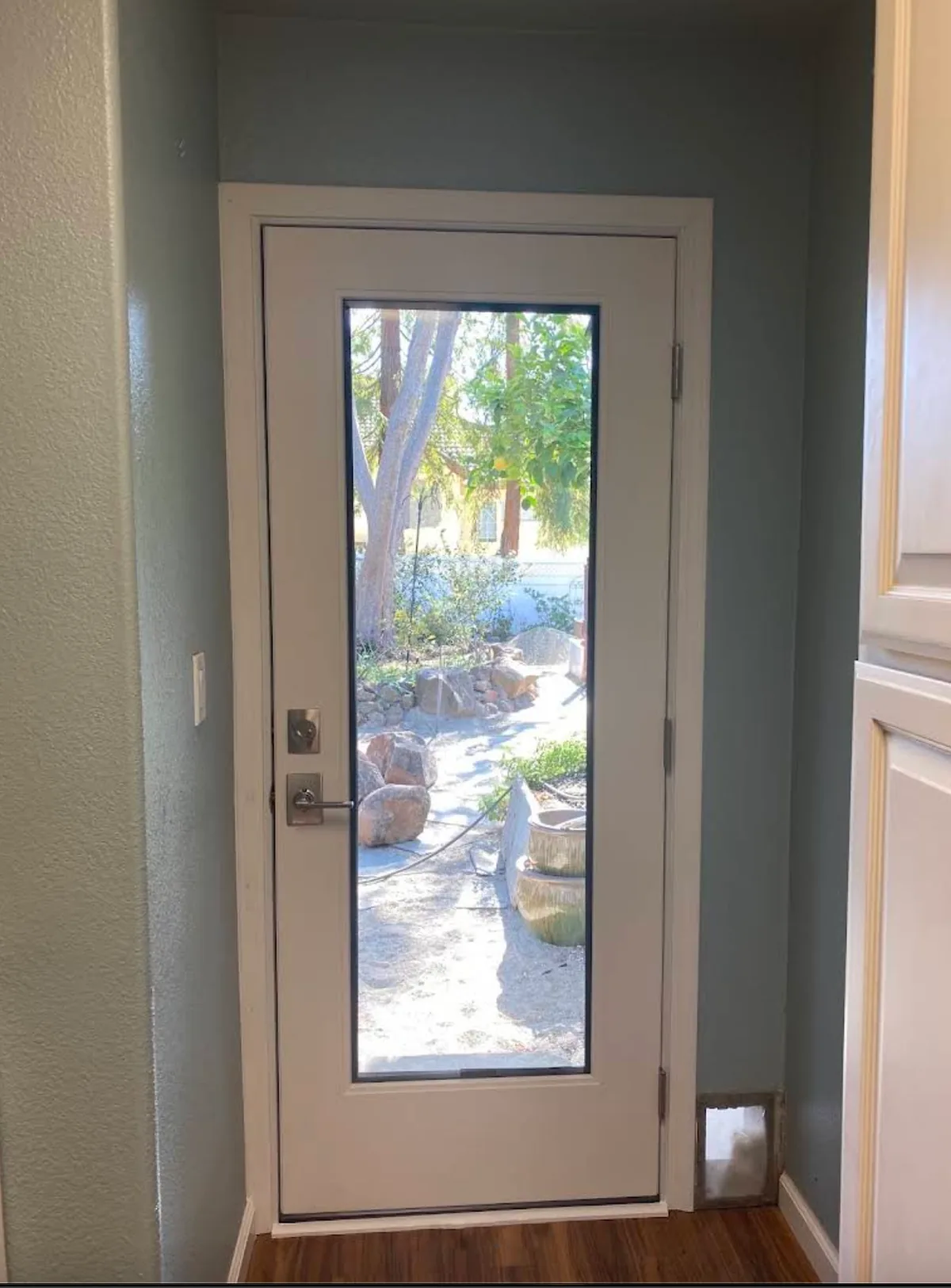 White side door with a large glass panel